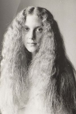 a black and white photo of a woman with long hair