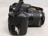 a black camera with a flash drive attached to it