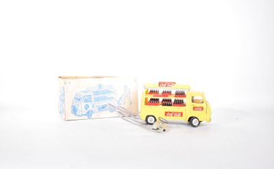 a yellow toy bus with a fork in front of it