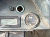 a close up of a car dashboard with a clock on it