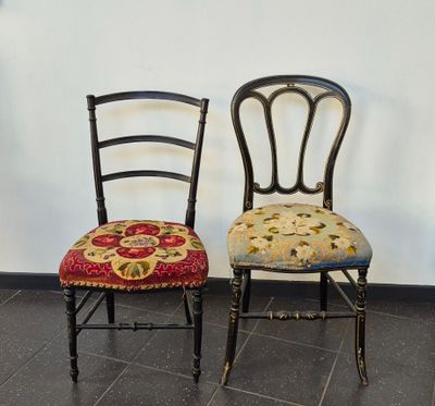 two chairs sitting next to each other on a tiled floor