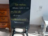 a sign that is on the floor in front of a table