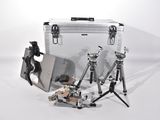 a silver case with a laptop and a tripod on it