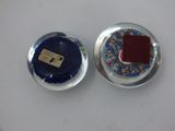 two plates with a red square on them on a white table