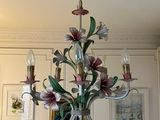 a chandelier hanging from the ceiling in a living room