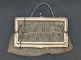 an antique silver mesh purse with chain and clasp