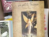 a box full of books and a picture of an angel on it