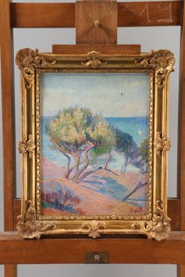 an oil painting of a beach scene on a wooden easel