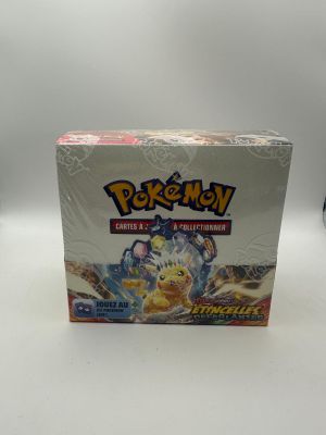 a box of pokemon trading cards on a white surface