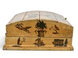 a small wooden box with a painting on it