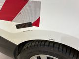 a close up of a white car with a red and white stripe on it