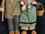 a couple of dolls that are standing next to each other