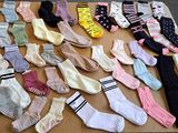 many pairs of socks laid out on a table