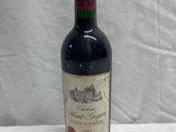 a bottle of wine that is sitting on a table