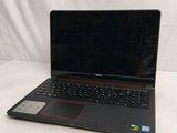 a laptop that is sitting on a white surface