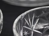 a close up of a glass bowl with a spoon inside of it