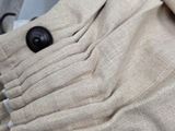 a close up of a pair of pants with buttons on them