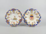 a pair of plates with a coat of arms on them