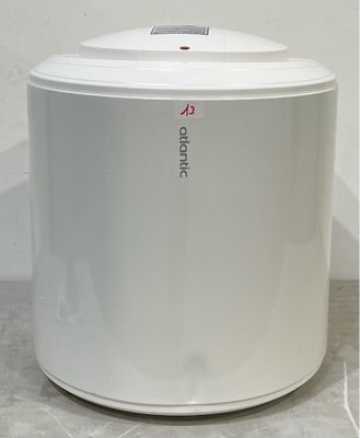 a white trash can sitting on the floor next to a white wall