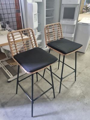 two stools that are next to each other in a room