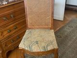 a chair that is sitting in the middle of a room