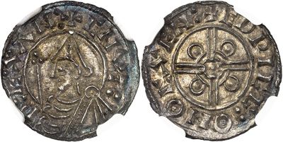 a silver coin with a cross on the front and a cross on the back
