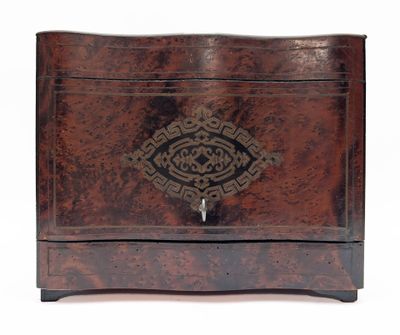 a small wooden box with a decorative design on it