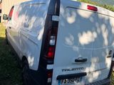 a white van that is parked in the grass