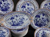several blue and white plates are stacked on top of each other