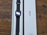 apple watch in box on wooden table with wooden table top