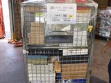 a man standing next to a cart with boxes on it