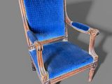 an image of a blue chair on a gray background with a shadow