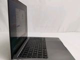 a laptop that is sitting on a white surface
