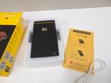 a box with a phone inside of it on a table
