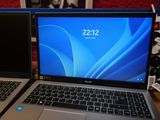 two laptops sitting side by side on a table