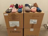 two boxes with shoes on top of them on the floor