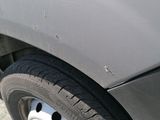 a close up of a flat tire on a truck