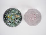 two glass bowls with different colored designs on them