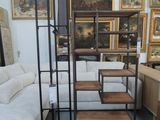 a room with a lot of furniture and pictures on the wall