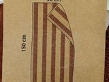 a cardboard package with a brown and white striped design on it