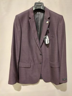 the jacket is purple and has a white tag on it