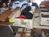 a pile of boxes sitting on top of a table in a garage