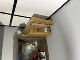 a shelf with a box and a cup on it