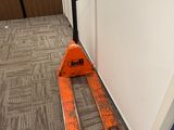 a pair of skis sitting on the floor next to a wall