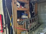 an image of a van with tools in the back of it