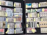 an open book with stamps and post - it notes on it