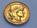an image of a gold coin with a woman ' s face on it