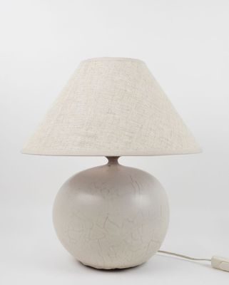an image of a white lamp with a beige shade on it