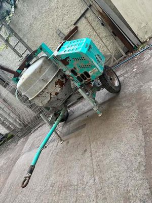 a small machine that is sitting on the sidewalk