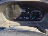 a car dashboard with a speedometer and a clock on it